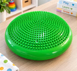 Green Sprout Cushion™ sensory balance cushion showing the textured raised-bump surface and inflation valve