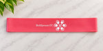  Red SkillSprouts OT SproutBand™ Chair Wiggle Band with white logo on a light marble surface.